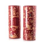 A PAIR OF CHINESE UMBRELLA STANDS, 20TH CENTURY each of cylindrical form, painted overall with