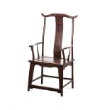 A CHINESE HARDWOOD YOKEBACK ARMCHAIR the curved top rail above turned supports centred by a carved
