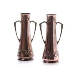 A PAIR OF WHITE AND SONS ARTS AND CRAFTS COPPER VASES, CIRCA 1900 of tapering cylindrical form,