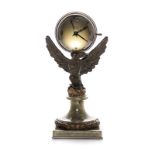 A FRENCH PATINATED BRONZE AND MARBLE CLOCK, CIRCA 1930 modelled as an eagle standing on a rocky