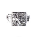 A DIAMOND RING centred with a round brilliant-cut diamond weighing 1.22cts, the stylised flower
