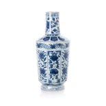 A CHINESE BLUE AND WHITE BOTTLE VASE, QIANLONG, 1736 - 1795 painted with alternating panels of peony