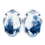 A PAIR OF DUTCH DELFT BLUE AND WHITE LANDSCAPE PLAQUES, LATE 19TH CENTURY the shaped border in