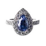 A TANZANITE AND DIAMOND RING centred with a pear-shaped mixed-cut tanzanite weighing 2.631cts, the