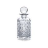 A CRYSTAL CUT DECANTER AND STOPPER, 20TH CENTURY of canted square-section form with star cut base,