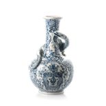 A DELFT STYLE BLUE AND WHITE URN, POSSIBLY VISTA ALEGRE the bulbous ribbed body with everted rim,