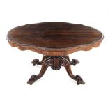 A VICTORIAN ROSEWOOD LOO TABLE the rectangular shaped moulded top above a plain frieze, on a