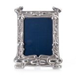 AN EDWARDIAN ART NOUVEAU PICTURE FRAME, WILLIAM AND NEALE & SON LTD, CHESTER the wooden blue