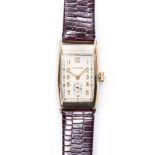 A GENTLEMAN'S 14CT GOLD WRISTWATCH, LONGINES manual, the beige rectangular dial with gilt Arabic