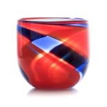 DAVID READE: (1960-): A LARGE ORANGE GLASS BOWL of tapering cylindrical shape, with blue spiralled
