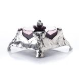A GERMAN ART NOUVEAU SILVERED PEWTER FLOWER BOWL AND LINER, ORIVIT, CIRCA 1900 of diamond shape,