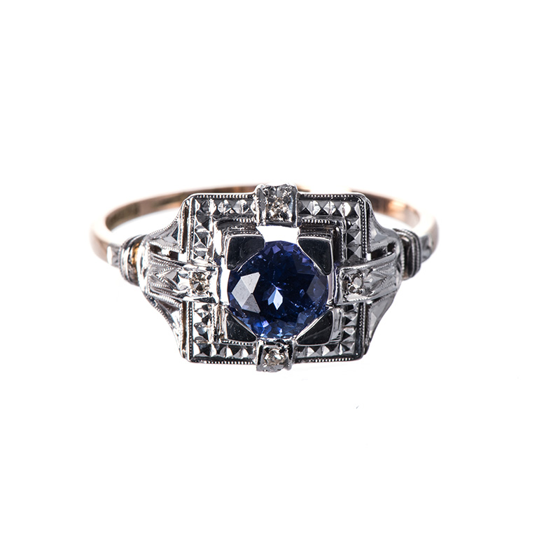 A TANZANITE RING centred with a circular mixed-cut tanzanite weighing approximately 1.04cts,