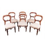 A SET OF SIX VICTORIAN MAHOGANY BUSTLE BACK CHAIRS each top rail above a carved and moulded mid-