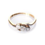 A DIAMOND RING set to the centre with three old-cut diamonds, impressed 18ct and PLAT, size L