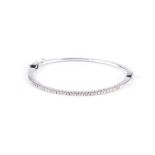 AN 18K WHITE GOLD AND DIAMOND BANGLE