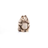 A JAPANESE IVORY WOLF NETSUKE, MEIJI PERIOD, 1868 - 1912