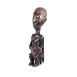 AN AKAN SEATED FEMALE FIGURE, LAGOON REGION, IVORY COAST, MID 20TH CENTURY