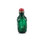 A CHINESE CARVED GREEN GLASS SNUFF BOTTLE