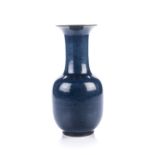 A CHINESE MONOCHROME BLUE TRUMPET-NECK VASE, QING DYNASTY, LATE 19TH CENTURY