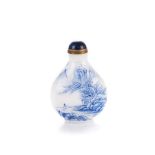 A CHINESE ENAMELLED WHITE GLASS SNUFF BOTTLE painted in blue, depicting a figure before a blossom