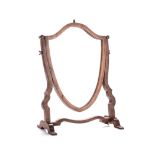 A VICTORIAN DRESSING TABLE MIRROR the crest shaped plate with conforming frame, suspended by