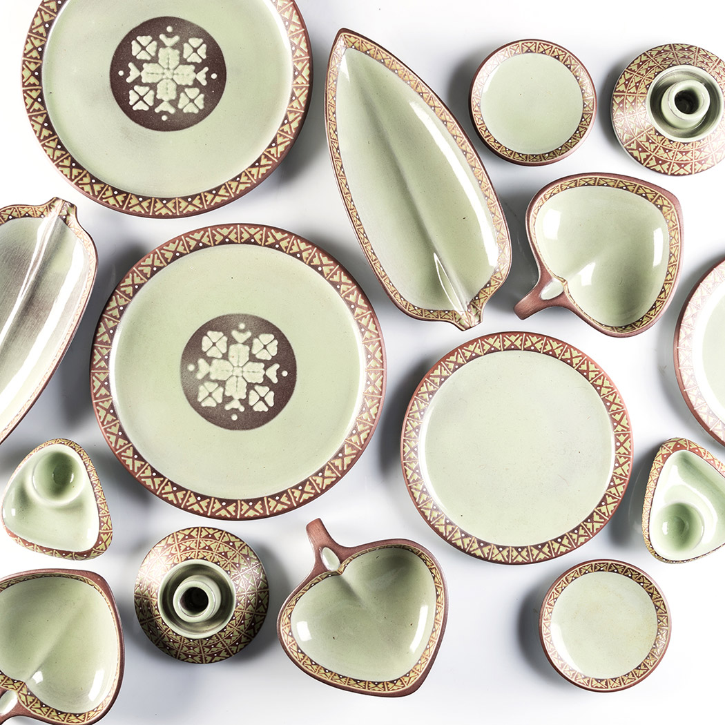 A KALAHARI TERRACOTTA PART DINNER SERVICE, 1950’S pea green glaze, earthen border with geometric