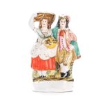A STAFFORDSHIRE FIGURE OF A FARMING COUPLE, 19TH CENTURY modelled standing, the lady holds a vase,