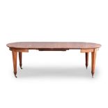 A GEORGE III MAHOGANY EXTENDING DINING TABLE each D-end above a plain frieze, on square section