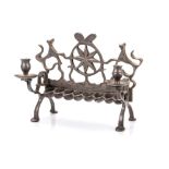 AN EASTERN EUROPEAN PEWTERED BRASS HANUKAH LAMP, PROBABLY LATE 18TH/EARLY 19TH CENTURY the backplate