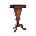 A VICTORIAN WALNUT AND EBONISED WORK TABLE the hinged octagonal top enclosing compartments in sizes,