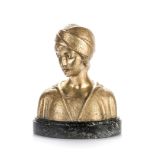 A TREFOLONI: A PATINATED BRASS BUST, ITALY, CIRCA 1920 depicting a young woman, eyes downcast,