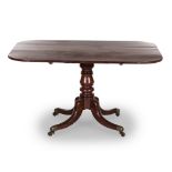 A MAHOGANY BREAKFAST TABLE, 19TH CENTURY the shaped hinged rectangular top on a ring-turned tapering