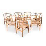 A SET OF EIGHT DANISH BEECH CH24 WISHBONE CHAIRS, DESIGNED BY HANS WEGNER IN 1949, MANUFACTURED BY