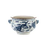 A CHINESE BLUE AND WHITE CENSER the bulbous body flaring to a brown rim, painted with dragons in