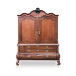 A DUTCH MAHOGANY ARMOIRE, 19TH CENTURY the moulded gabled pediment centred by a scrolling foliate