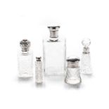 A GROUP OF FIVE MISCELLANEOUS SILVER-MOUNTED CUT GLASS PERFUME BOTTLE, VARIOUS MAKER'S AND DATES,