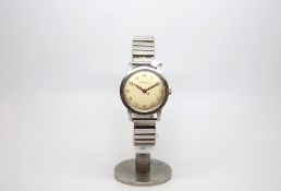 Gentlemen's stainless steel Garrards watch, circa 1950s, cream Arabic dial luminous numbers,