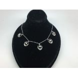 Diamond fringe necklace, set with five cluster drops of old and rose cut diamonds, with integrated