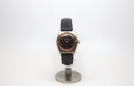 Vintage Rolex Oyster Perpetual Chronometer, circular black gloss dial with Roman numerals, rose gold