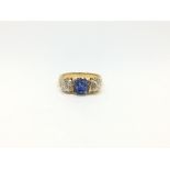 Sapphire and diamond ring, central cushion cut cornflower blue sapphire weighing an estimated 2.