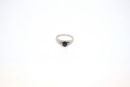 Single stone sapphire ring, 5.6mm round cut blue topaz, six claw setting, mounted in white metal