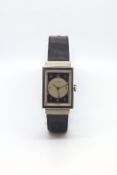 Movado mechanical movement, Art Deco Arabic silver and black dial, 22mm rectangular stainless