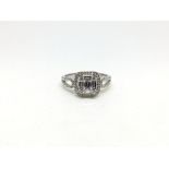 Diamond cluster ring, set with baguette and brilliant cut diamonds, with diamond set shoulders,