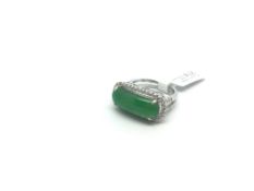 Jade and diamond ring, oblong cabochon cut jade measuring 18.7 x 7.15mm, surrounded by round