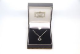 Black pearl and diamond pendant, 7mm black pearl with a diamond set border, 43cm chain, in white