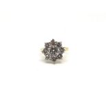 Diamond cluster ring, round brilliant cut diamonds, central diamond weighing an estimated 1.15ct,