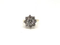 Diamond cluster ring, round brilliant cut diamonds, central diamond weighing an estimated 1.15ct,