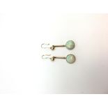 A pair of opal drop earrings, circular cabochon cut opals measuring approximately 9.60mm in