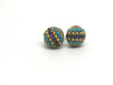 Gem set clip-on earrings, circular design set with cabochon sapphires and turqouise, in textured