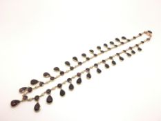 Foil backed garnet and pearl fringe necklace, graduating round and pear cut drops, spaced with